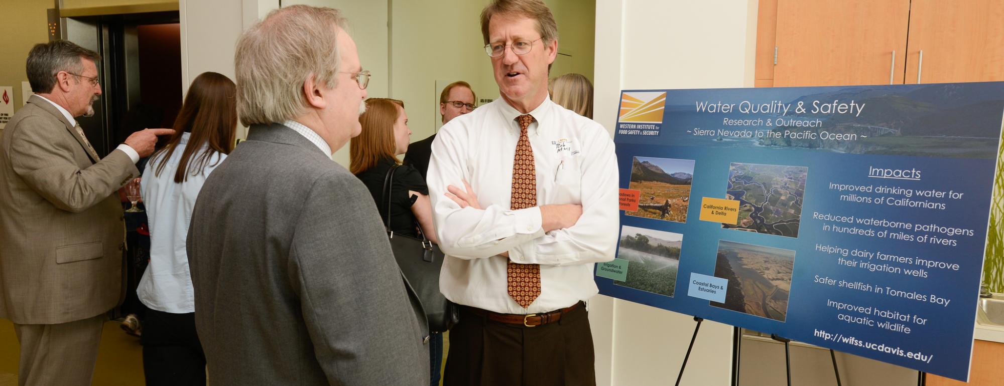 Dr. Edward Atwill talks to visitors about the research Water & Foodborne Zoonotic Disease Laboratory during the grand opening of the VetMed3B research building on March 15th 2013.